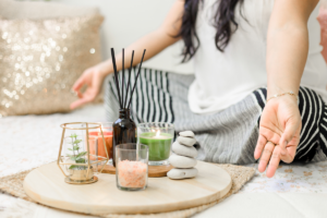 A woman meditating with incense