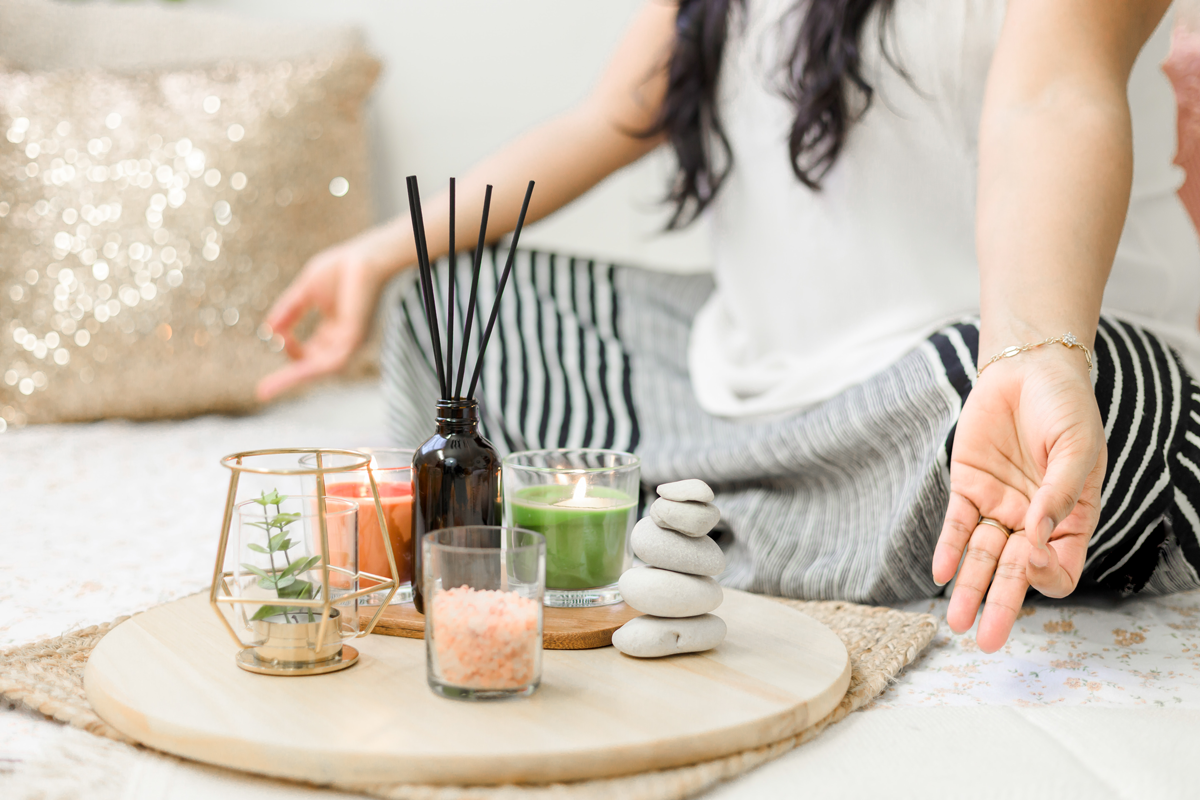 A woman meditating with incense