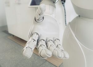 A robotic hand in front of a hospital, or therapy, setting